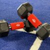 Red Fat Grips on Dumbbells for Superior Grip Training