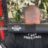 Fitness Pro Demonstrates Squat with Barbell Pad
