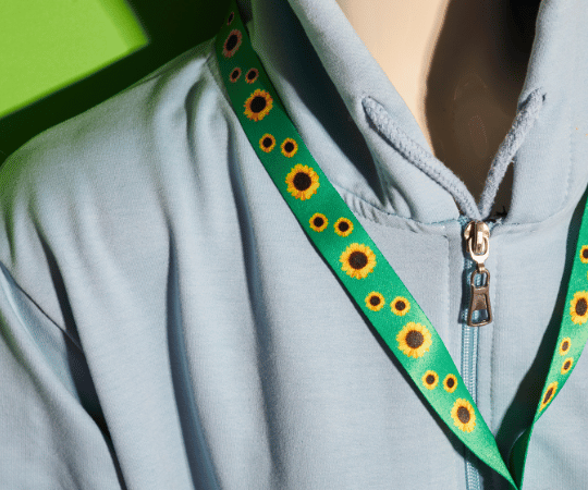 Person wearing a Hidden Disabilities Sunflower lanyard to subtly indicate a non-visible disability