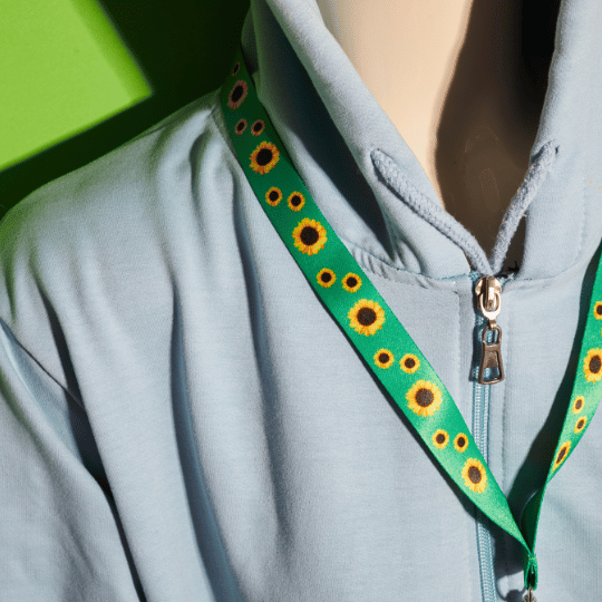Person wearing a Hidden Disabilities Sunflower lanyard to subtly indicate a non-visible disability
